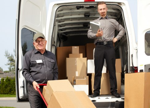 Team safely loading furniture into a van