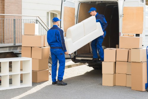 Packed boxes and furniture ready for relocation