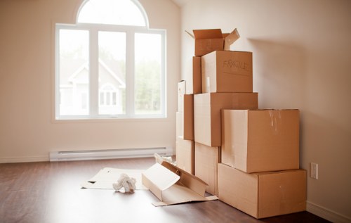 Removal staff loading household items into a van