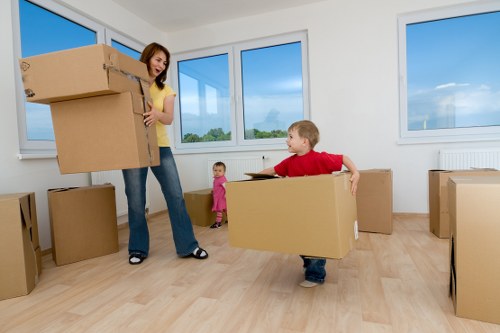 Boxes and furniture being unloaded at a new home