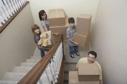 Professional movers loading a van on a Twickenham street